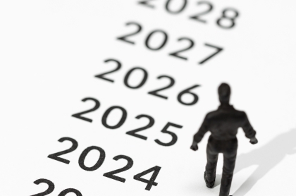 Retired couple sitting on a park bench after a bike ride.