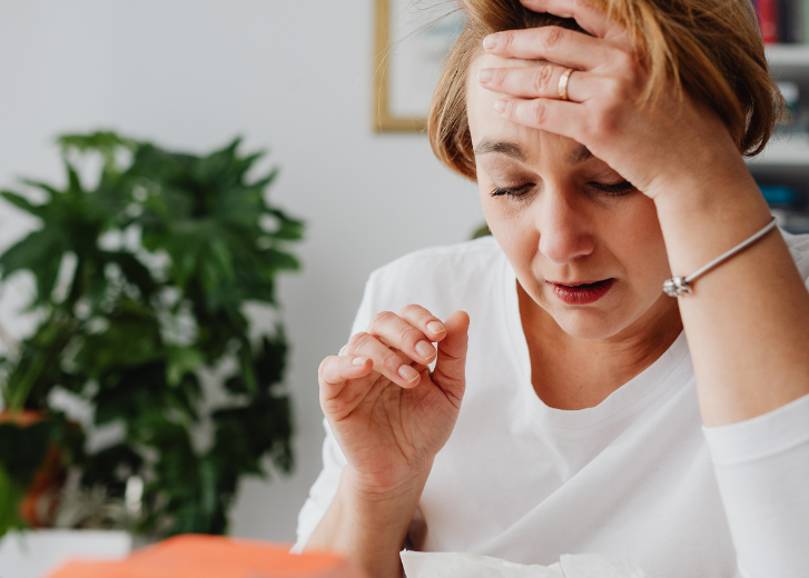 Woman widow trying to manage finances and getting frustrated