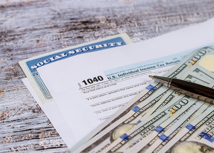 Dollar bills on paper work