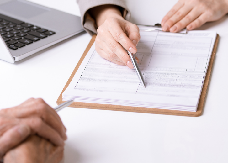 Blog feature image of financial advisor with client